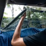 Car Side Window Film Removal And Tinting Installation. Male Auto