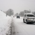 Bizzard in Washington DC area, car driving on snow