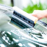 windscreen replacement services - cleaning windscreen