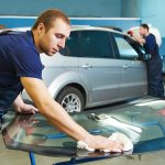 Windscreen replacement services - glazier adding glue on windscreen