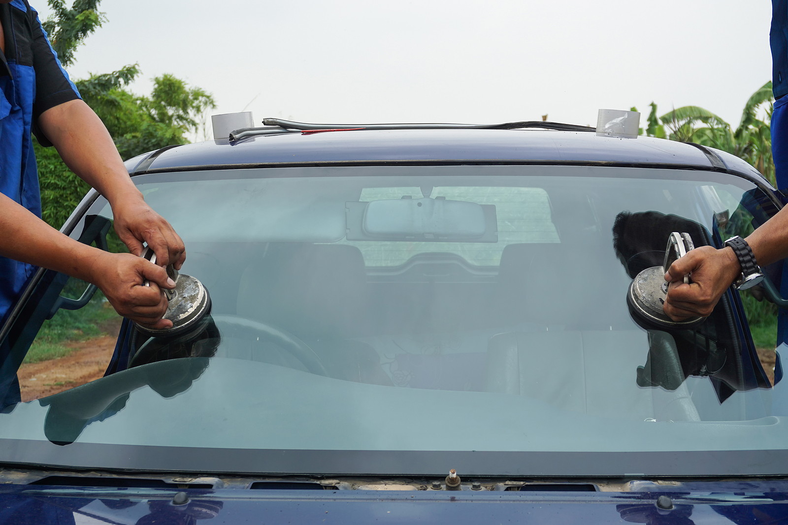repairing windshield replace windscreen wiper tools fix crack broken front window glass car vehicle services by Glazier. Maintenance repair, replace windshield, windscreen car wiper concept.